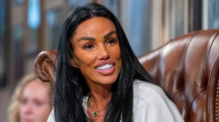 Katie Price puts on a strong face during show while husband spends jail time