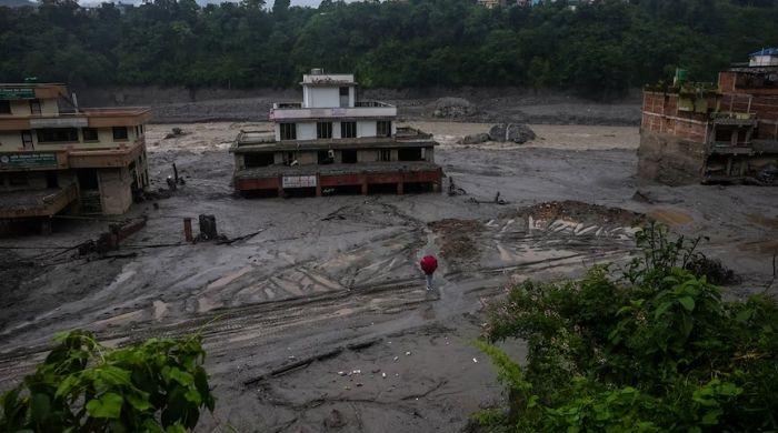Nepal issues new flood warning as hard-hit border region becomes swampland