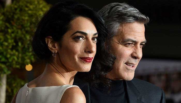 George Clooney with  his wife Amal Clooney
