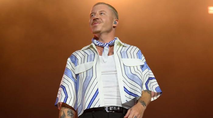 Macklemore reacts after being dropped from Ed Sheeran's U.S. Loop Tour