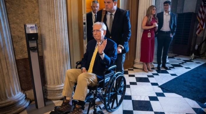 Mitch McConnell, 84, returns to Senate in wheelchair after hospitalisation