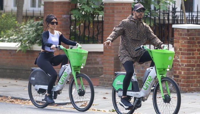 Kim Kardashian, Lewis Hamilton look loved up as couple poses for camera in matching outfits