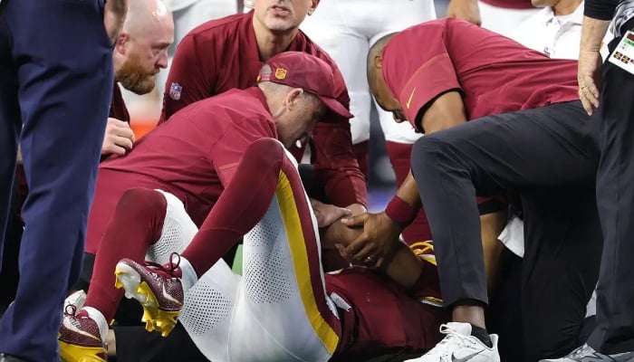 Commanders star Jayden Daniels suffers another left elbow injury against Cowboys