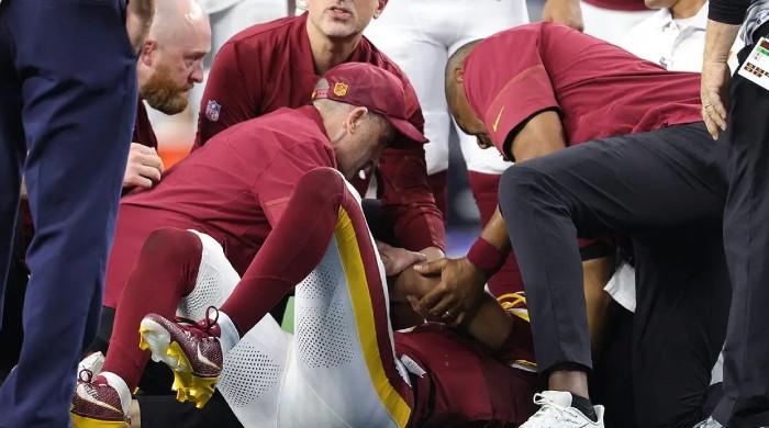 Commanders star Jayden Daniels suffers another left elbow injury against Cowboys