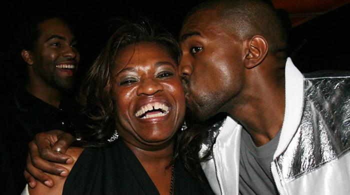 Why is Kanye West in Chicago and what is the link to his mother Donda?