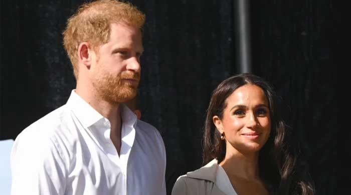 Harry and Meghan issue statement after men caught watching Archie and Lilibet's school