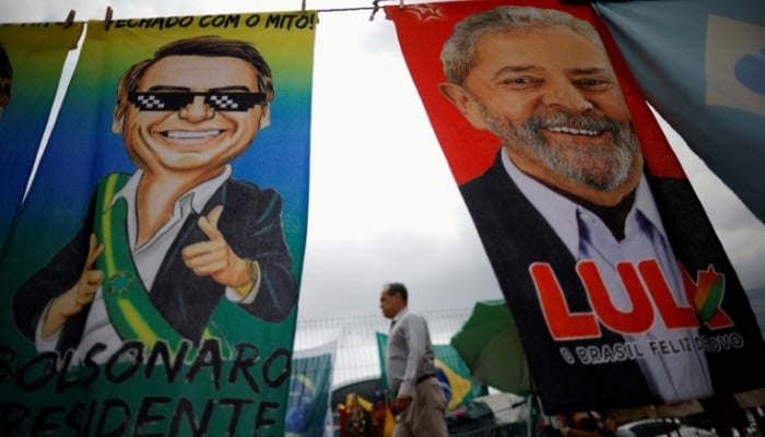 Brazil votes in tight race between Bolsonaro and Lula as polls close
