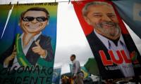 Brazil votes in tight race between Bolsonaro and Lula as polls close