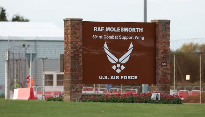 Two Latvian nationals arrested after hole found in fence at UK military base