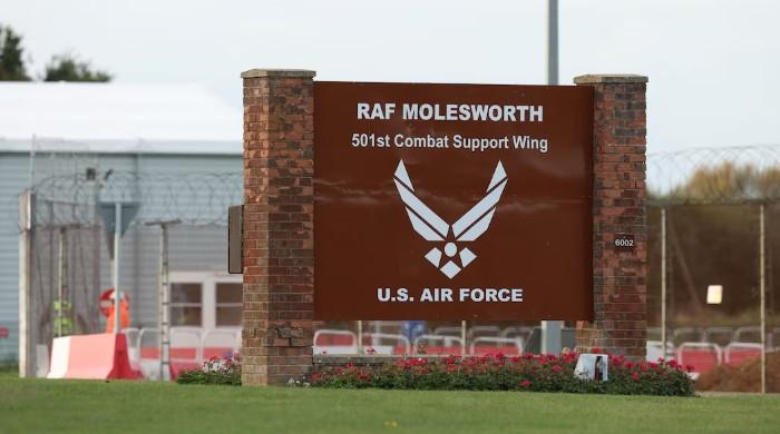 Two Latvian nationals arrested after hole found in fence at UK military base