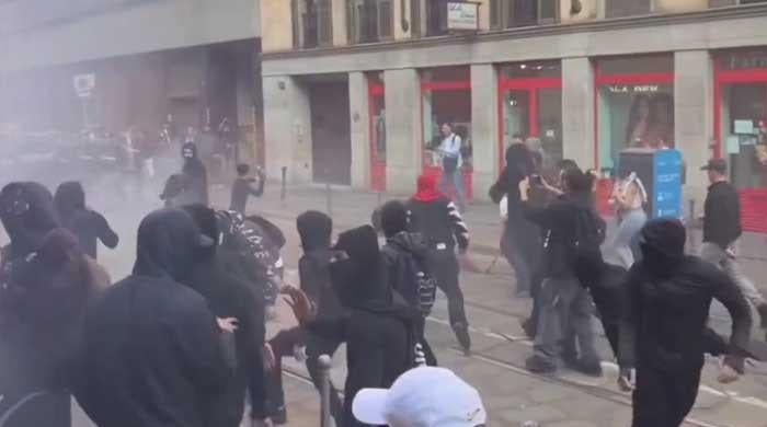 Why are people protesting in Milan? 