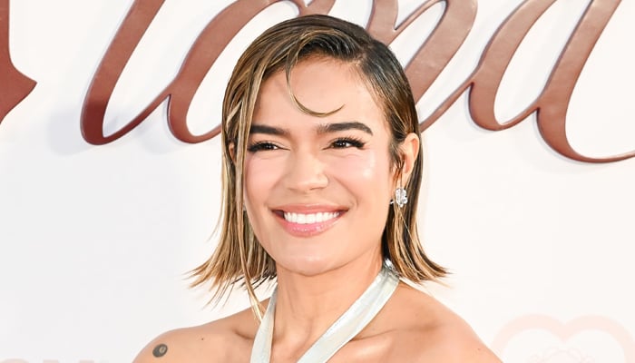 Karol G details how ‘losing so much weight’ is affecting her muscles