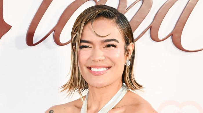 Karol G details how ‘losing so much weight’ is affecting her muscles 